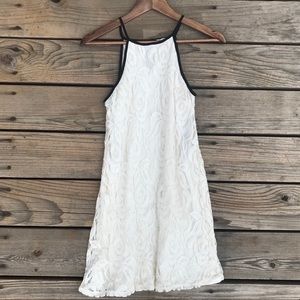 white lacey doll dress with black detailing